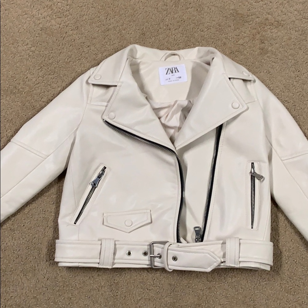 Cream leather coat.